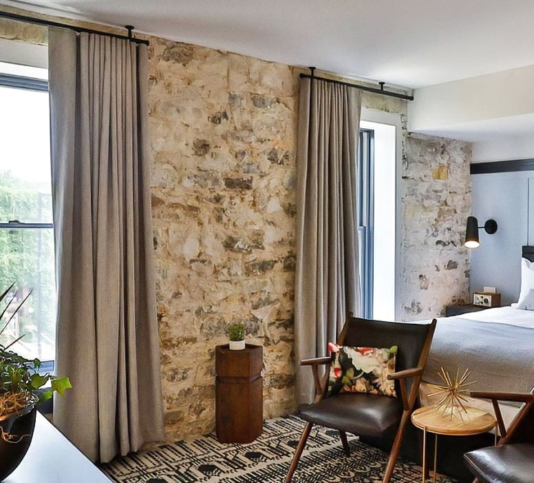 Gray Custom Curtains on Brick Accent Wall