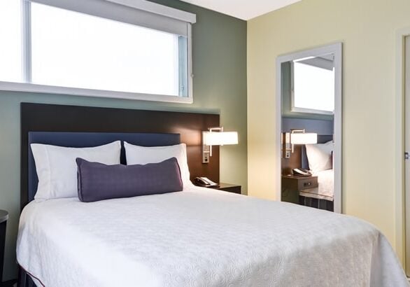home 2 shades above bed
