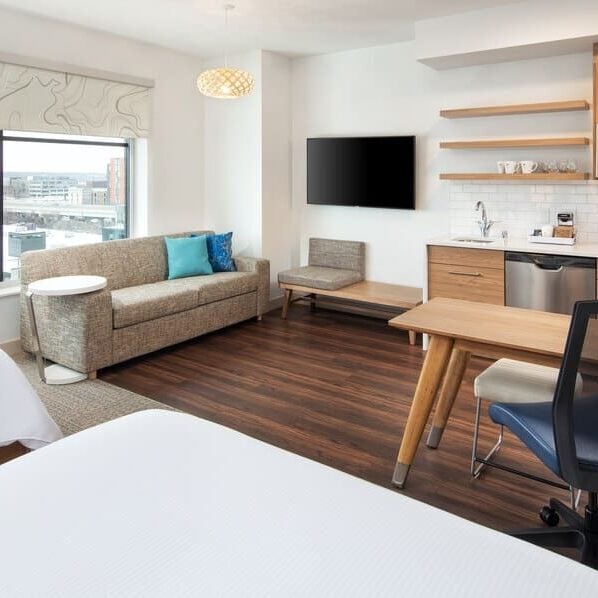 shade window treatments in hotel room with double beds